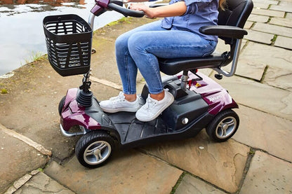 Showing a woman sat on the airium, driving alongside a canel. Showing ample footspace, comfortable seat and a smooth ride.