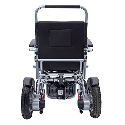 Showing the rear of the Freedom Chair DE08L Powerchair. You can see the area where the batteries slot in to, as well as the large 14" pneumatic rear tyres.