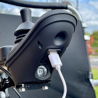 Showing the Freedom Chair USB socket, where you can plug a UDB cord into, to potentially charge your phone whilst out and about. 